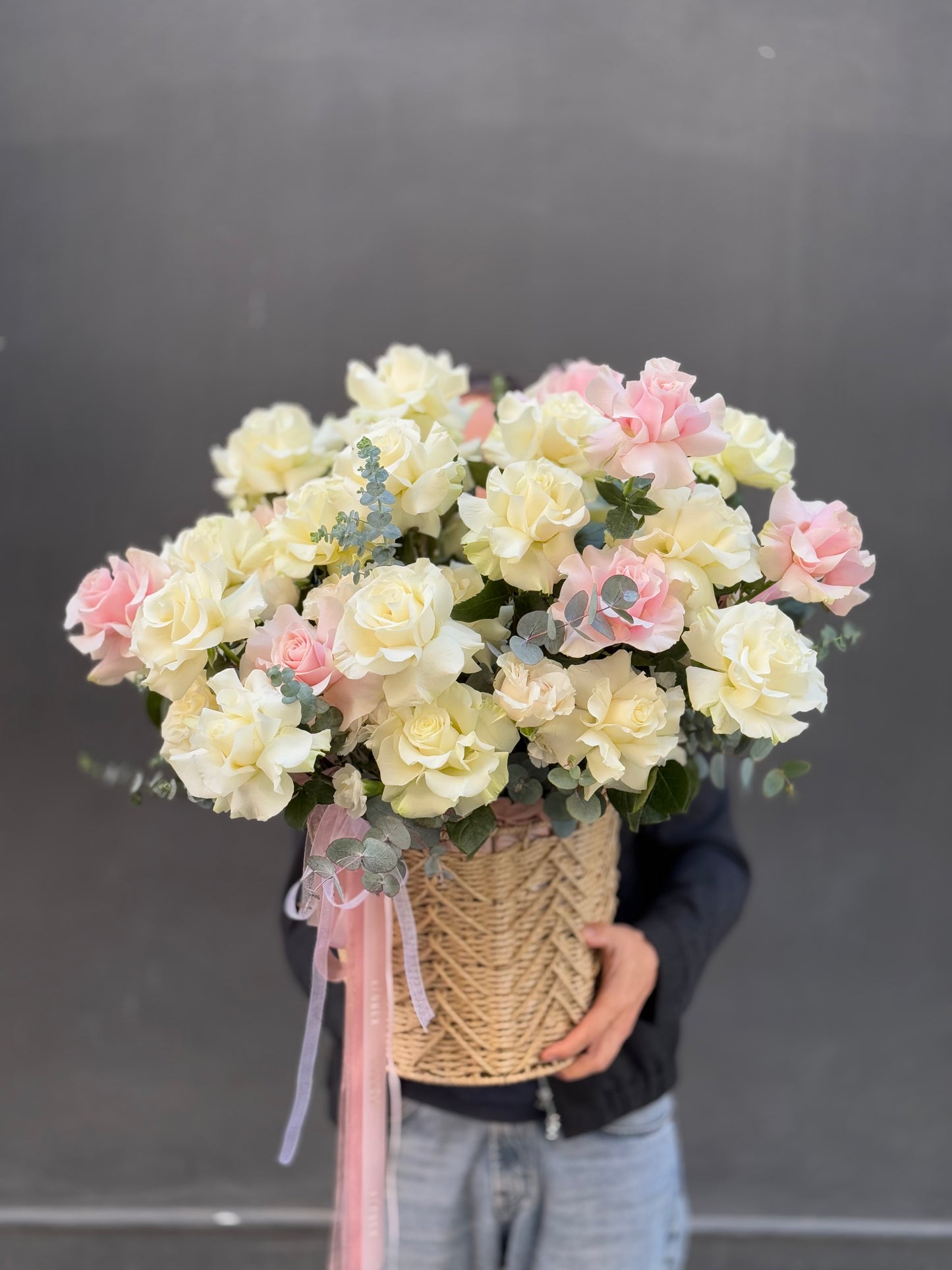 Basket with pink and white roses
